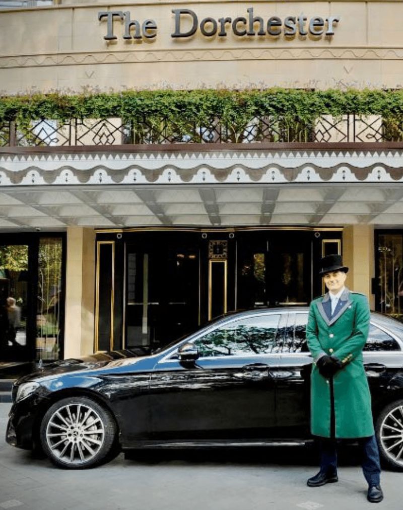 A black Mercedes E-Class outside The Dorchester hotel in London